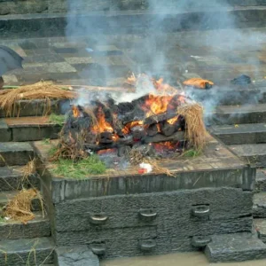 a fire burning on a stone steps